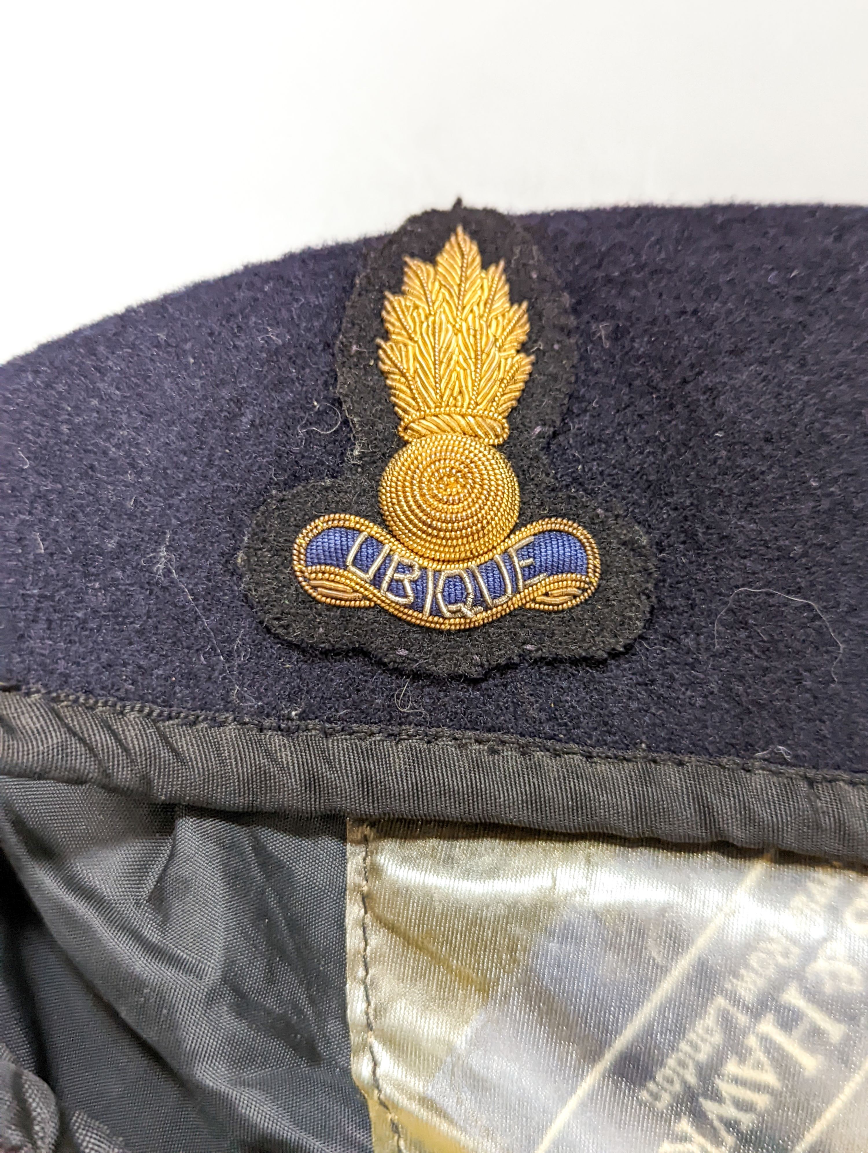 Three rare incendiary cartridge cut always, a beret with rare Royal Engineers officer's bullion wire '9-flame' cap badge, ARP bell dated '39 and various Boys Brigade cap badges
